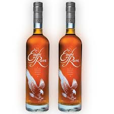 Two bottles of Eagle Rare bourbon whiskey on a white background